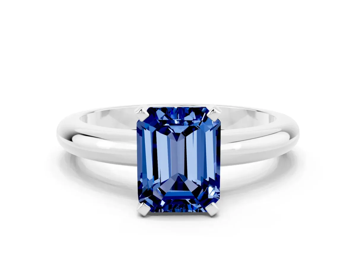 Emerald Cut Blue Sapphire Solitaire Engagement Ring with Round Band and Four-Prong Setting Platinum