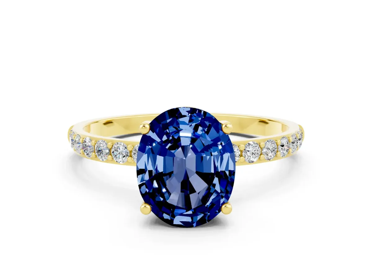 Oval Cut Blue Sapphire Solitaire Ring with Round Pavé Band and Prong Setting Yellow gold