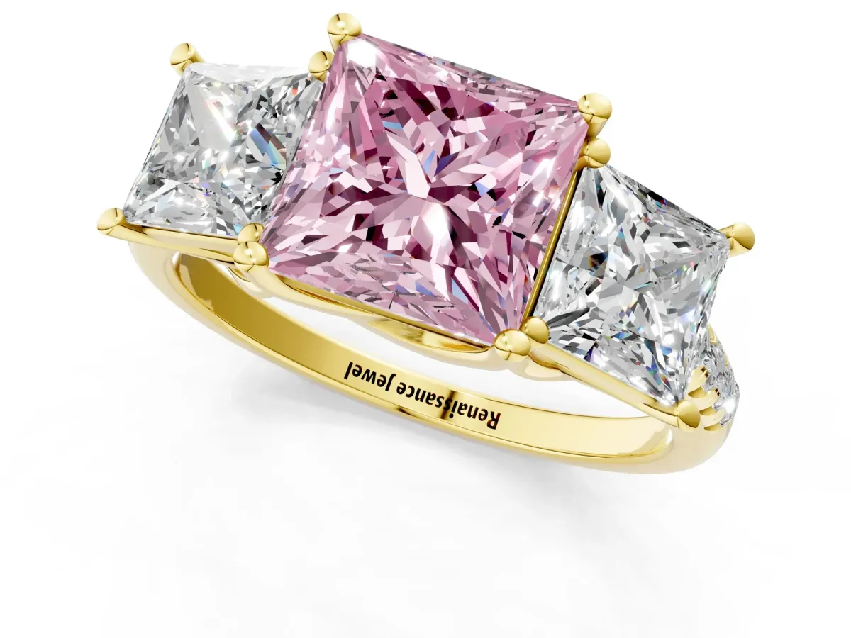 Fancy Pink Three-Stone Princess Cut Diamond Ring with Round Pavé Band and Prong Setting Yellow gold