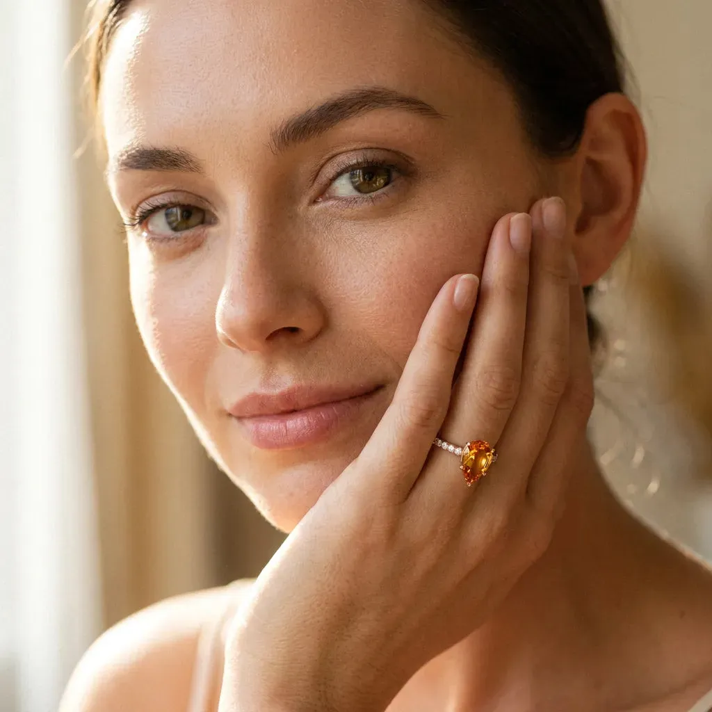 Pear Cut Citrine Solitaire Ring with Round Pavé Band and Four-Prong Setting Rose gold