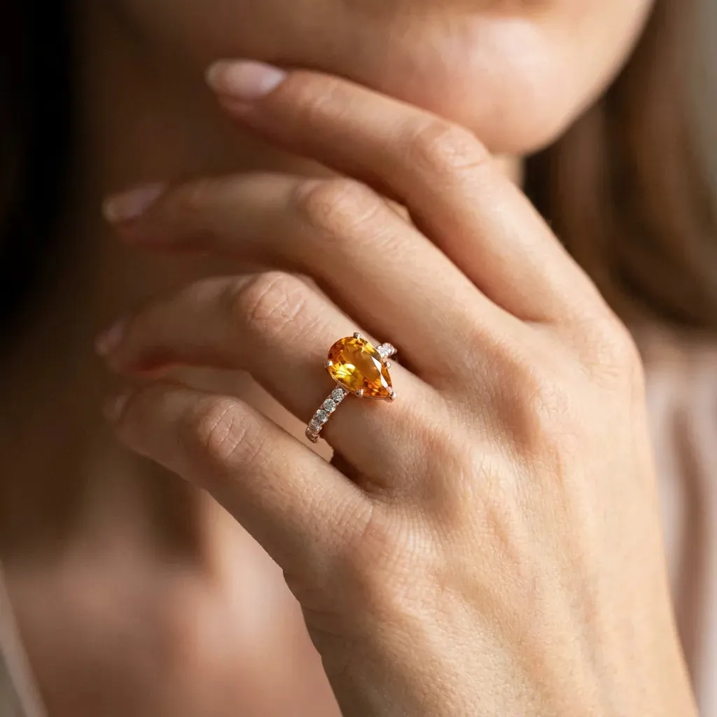 Pear Cut Citrine Solitaire Ring with Round Pavé Band and Four-Prong Setting Rose gold