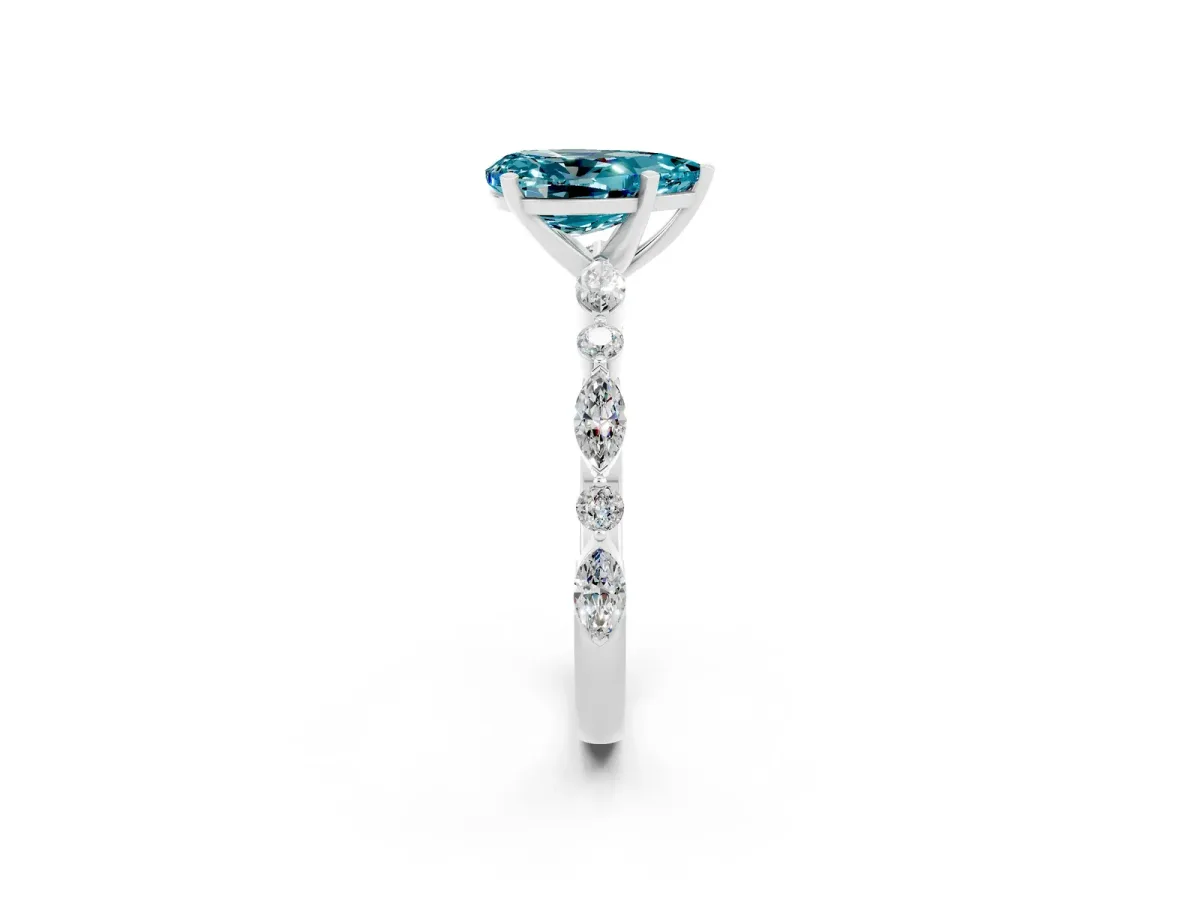 Pear Cut Blue Topaz Ring with Marquise and Round Side Stones and Four-Prong Setting Platinum