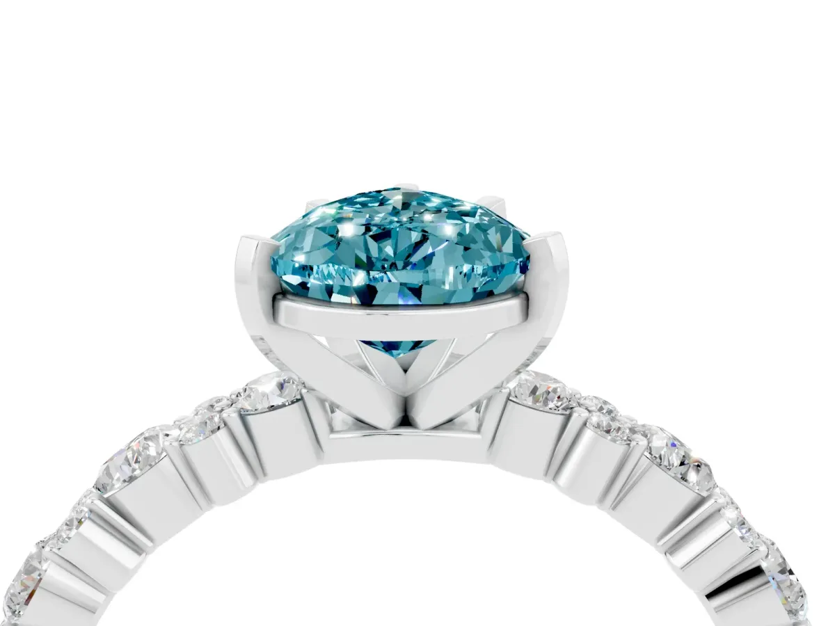 Pear Cut Blue Topaz Side Stone Solitaire Ring with Round and Four-Prong Setting White gold