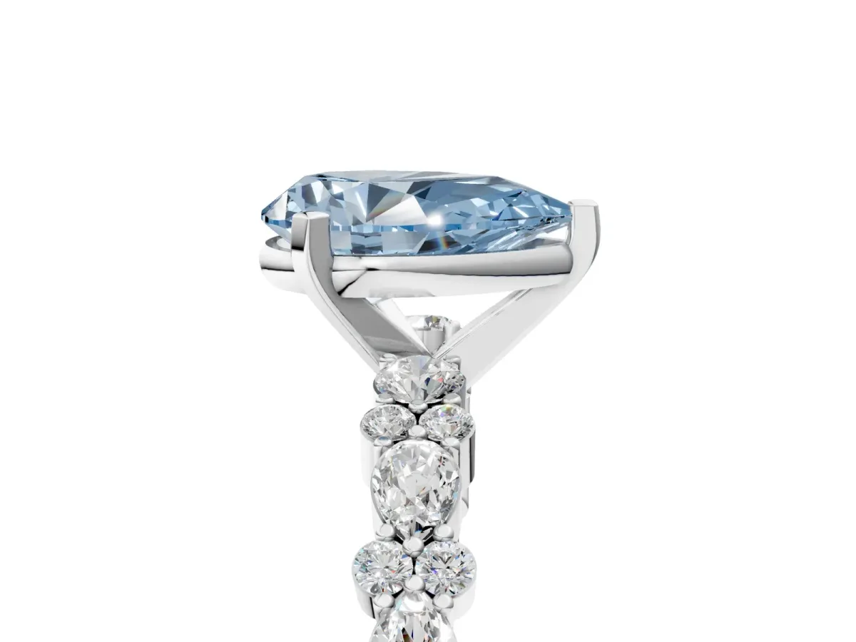 Fancy Blue Pear Cut Diamond Side Stone Solitaire Ring with Round and Four-Prong Setting Platinum
