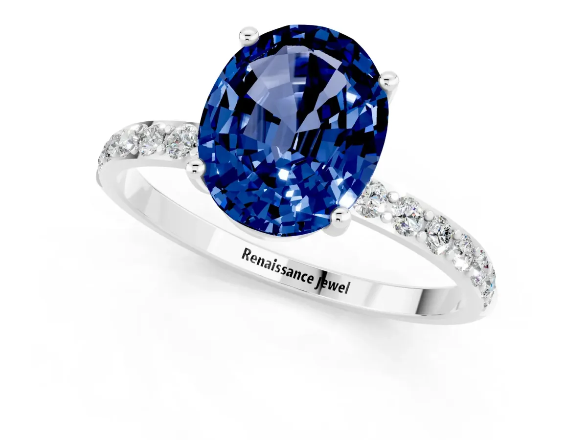 Oval Cut Blue Sapphire Solitaire Ring with Round Pavé Band and Prong Setting Silver