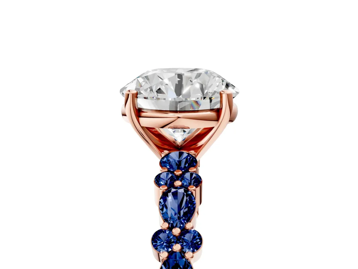Round Cut Diamond Side Stone Solitaire Ring with Round Blue Sapphire and Four-Prong Setting Rose gold