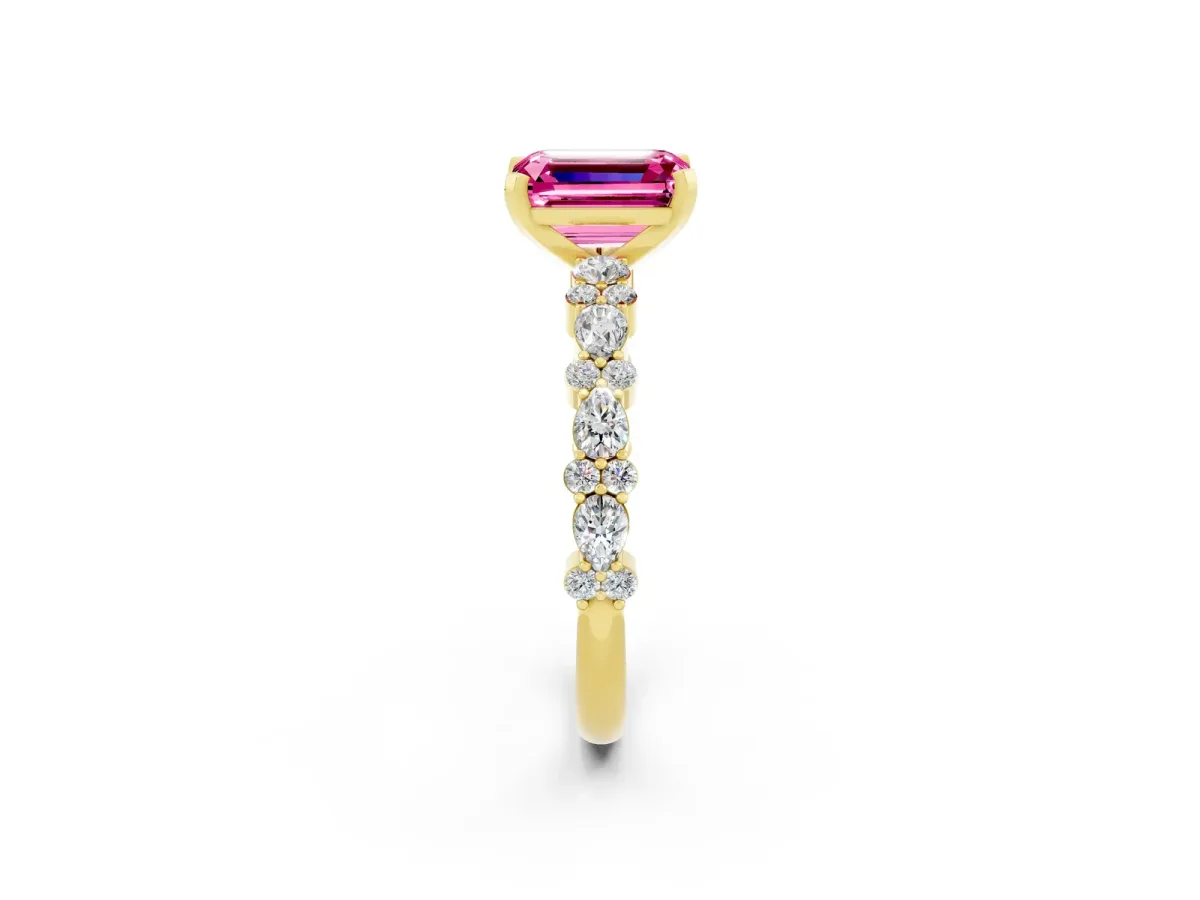 Emerald Cut Pink Sapphire Side Stone Solitaire Ring with Round and Four-Prong Setting Yellow gold