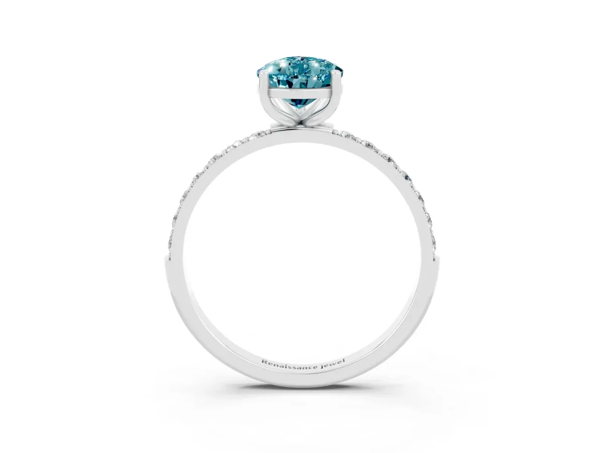 Pear Cut Blue Topaz Solitaire Ring with Round Pavé Band and Prong Setting Silver