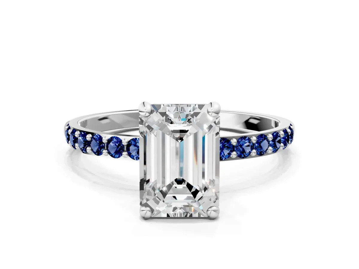 Emerald Cut Diamond Solitaire Ring with Round Blue Sapphire Pavé Band and Prong Setting Silver
