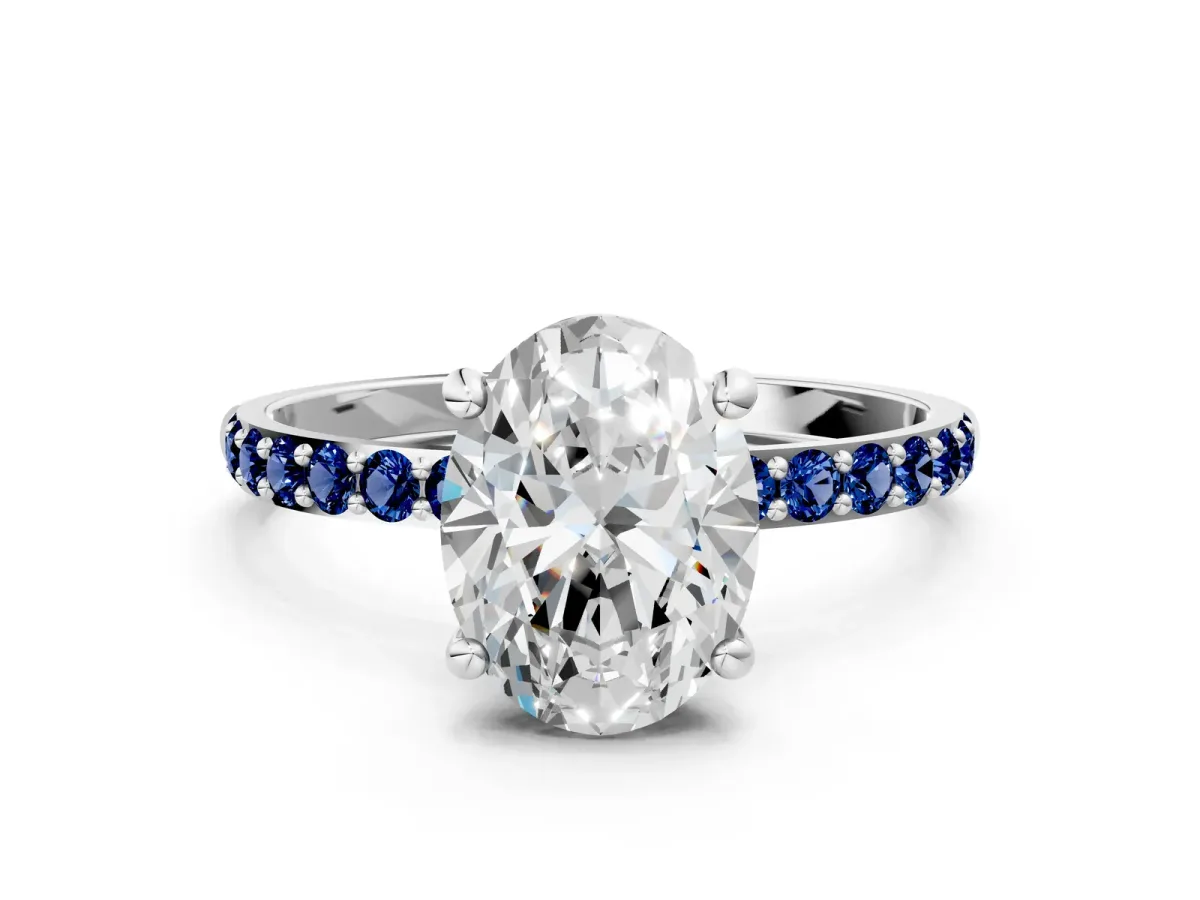 Oval Cut Diamond Solitaire Ring with Round Blue Sapphire Pavé Band and Prong Setting Platinum