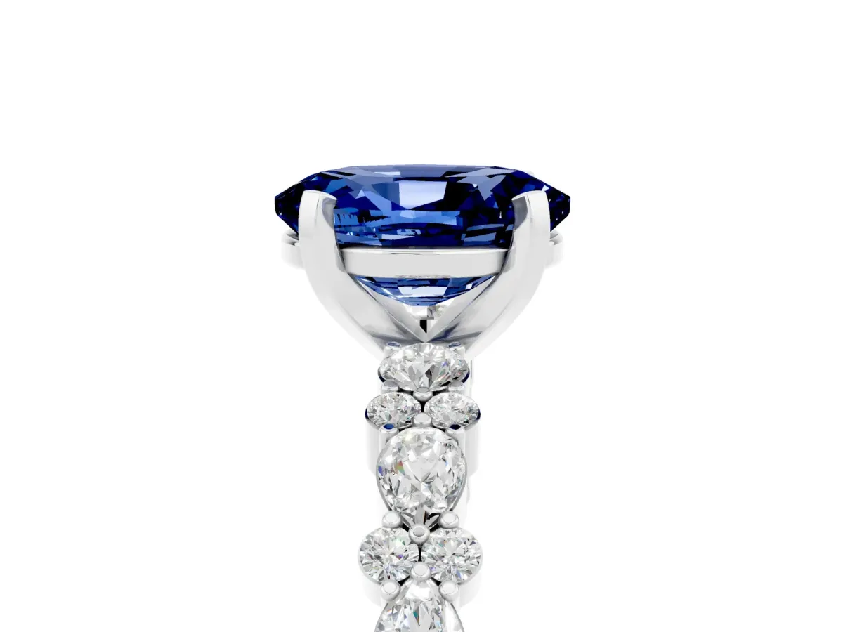 Oval Cut Blue Sapphire Side Stone Solitaire Ring with Round and Four-Prong Setting White gold