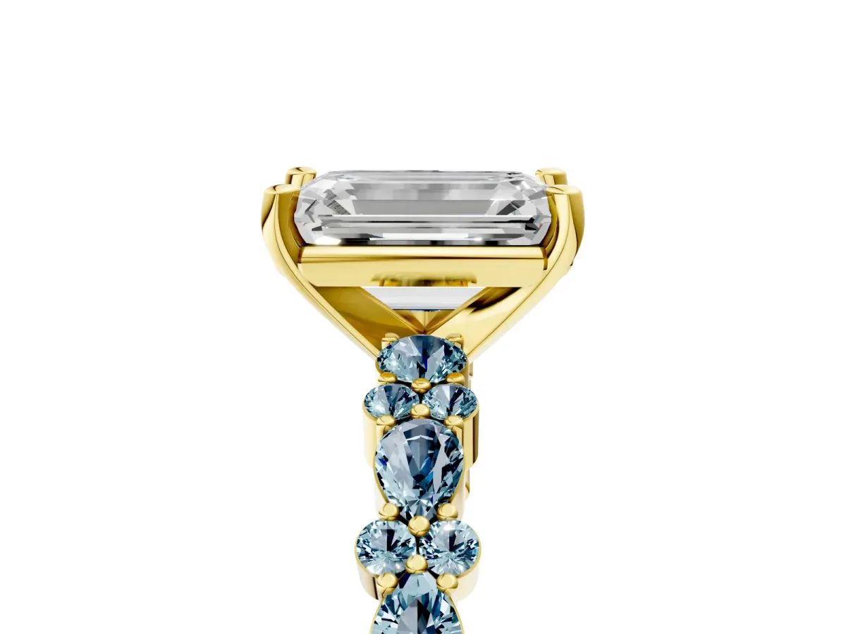 Emerald Cut Diamond Side Stone Solitaire Ring with Round Aquamarine and Four-Prong Setting Yellow gold