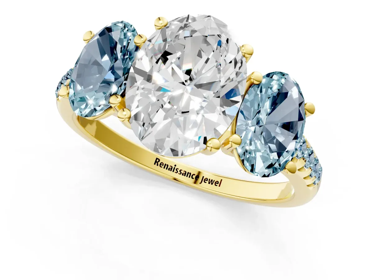 Three-Stone Oval Cut Diamond Ring with Round Aquamarine Pavé Band and Prong Setting Yellow gold