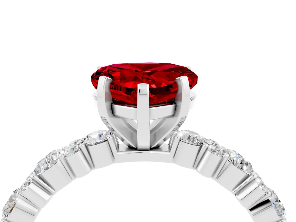 Heart Cut Ruby Side Stone Solitaire Ring with Round and Four-Prong Setting Platinum