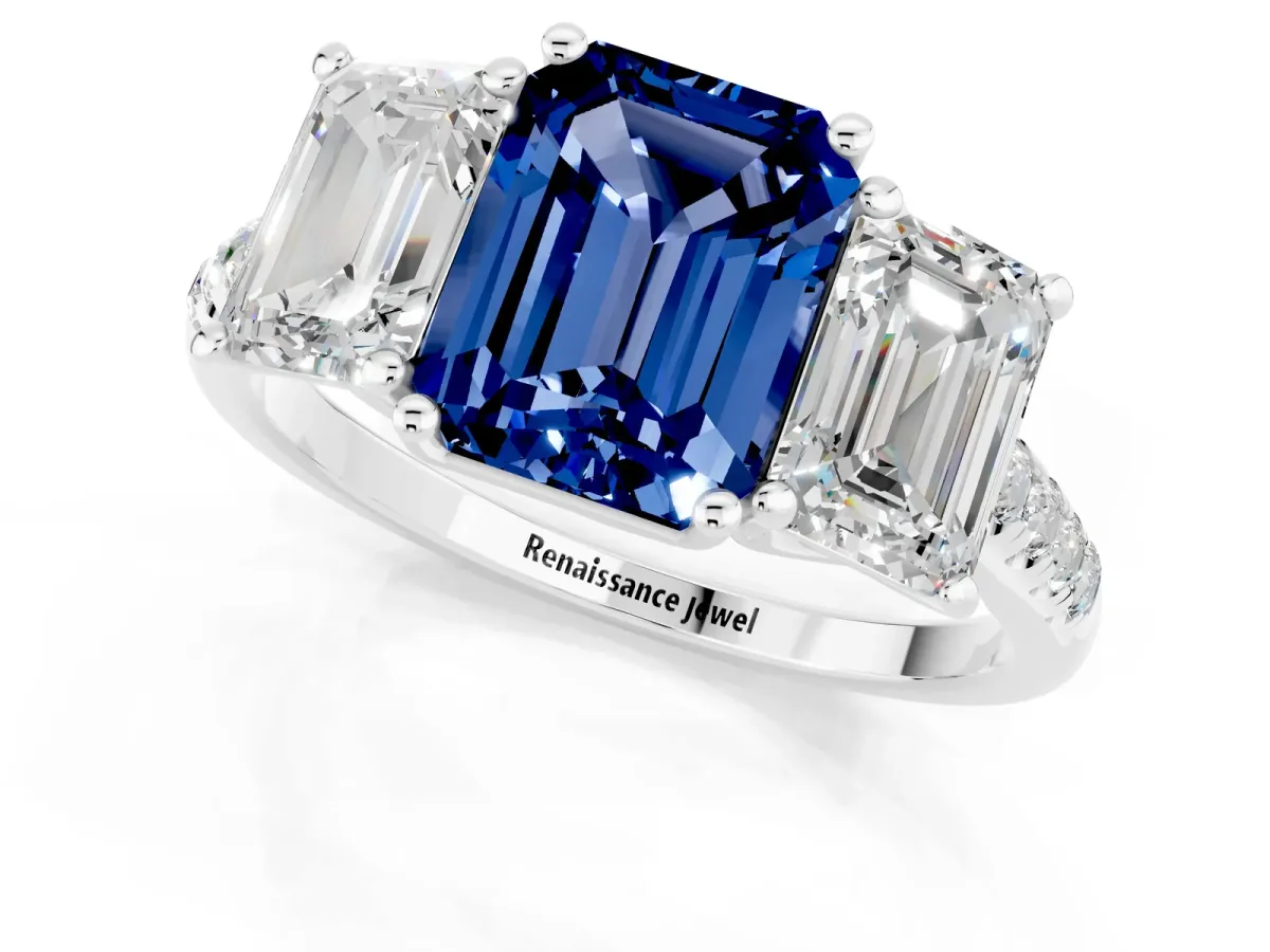 Three-Stone Emerald Cut Blue Sapphire Ring with Round Pavé Band and Prong Setting Platinum