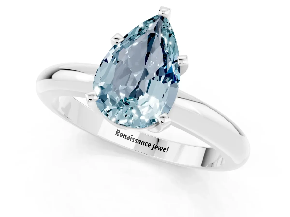 Pear Cut Aquamarine Solitaire Engagement Ring with Round Band and Four-Prong Setting Silver