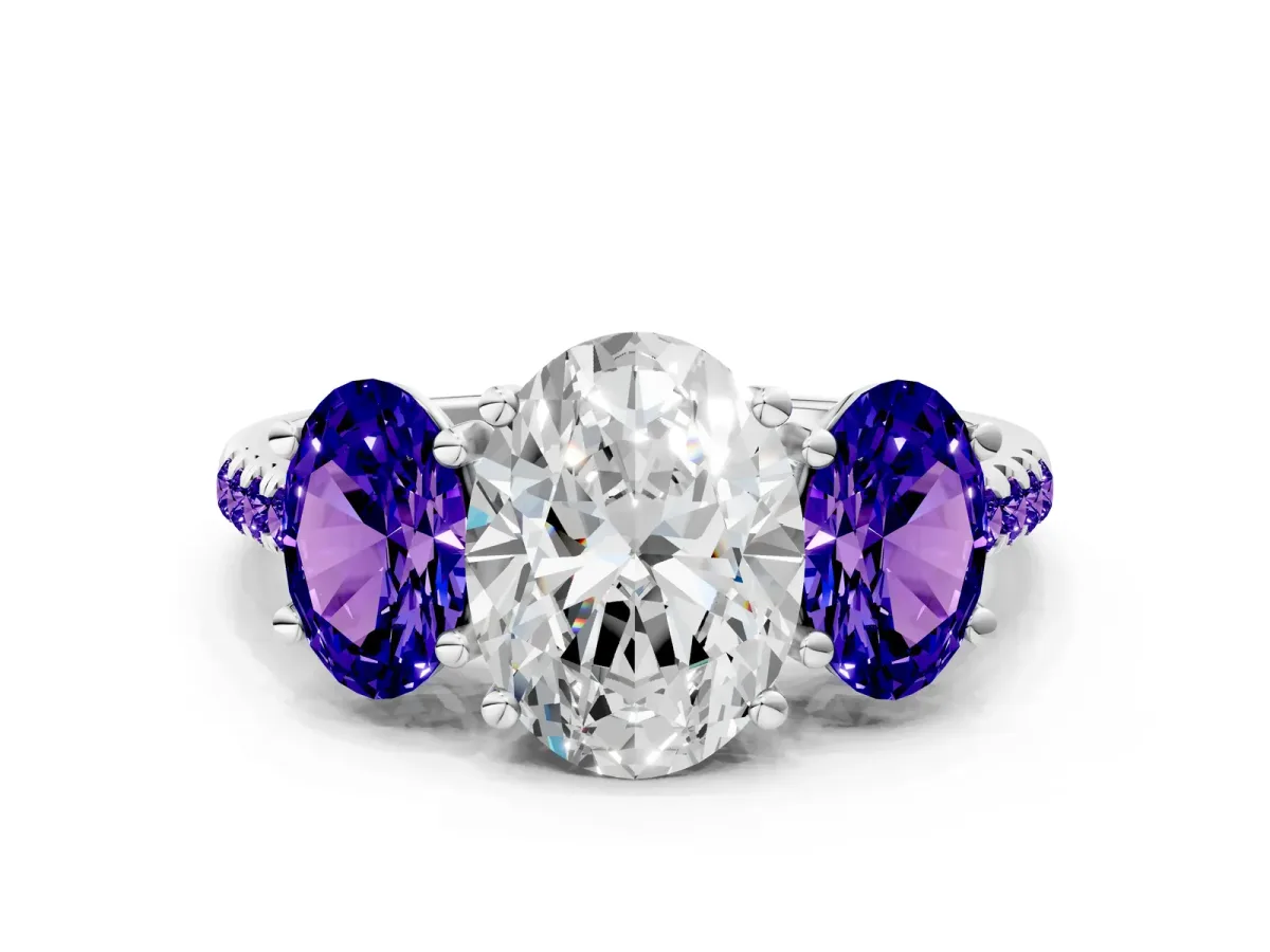 Three-Stone Oval Cut Diamond Ring with Round Tanzanite Pavé Band and Prong Setting Platinum