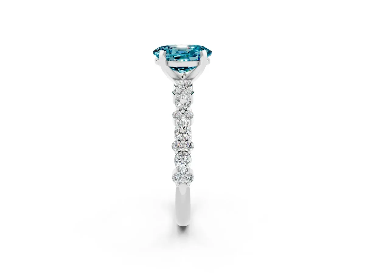 Oval Cut Blue Topaz Side Stone Solitaire Ring with Round and Four-Prong Setting Silver