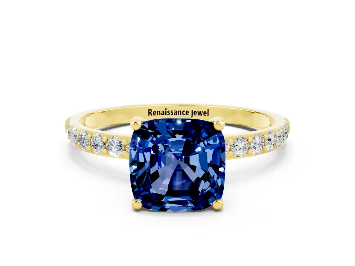 Cushion Cut Blue Sapphire Solitaire Ring with Round Pavé Band and Prong Setting Yellow gold