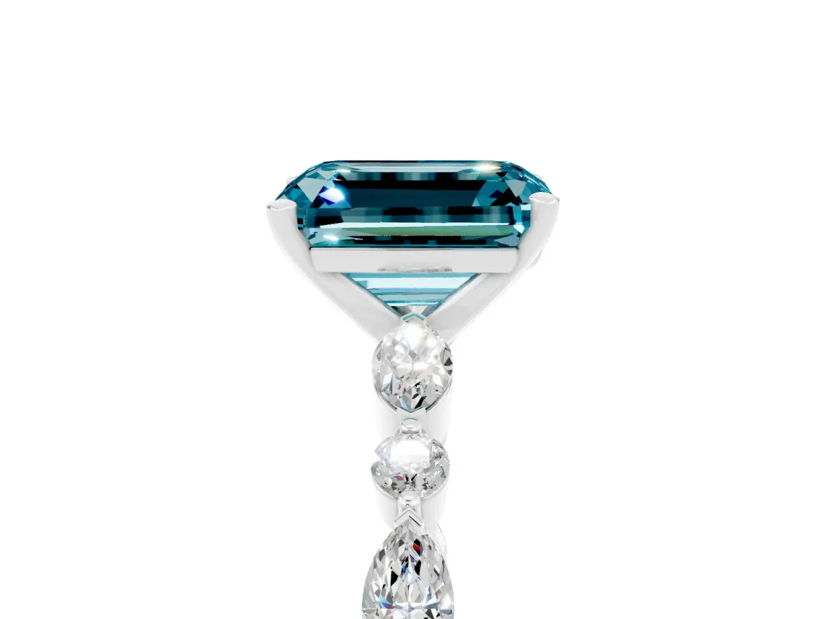 Emerald Cut Blue Topaz Ring with Marquise and Round Side Stones and Four-Prong Setting Silver