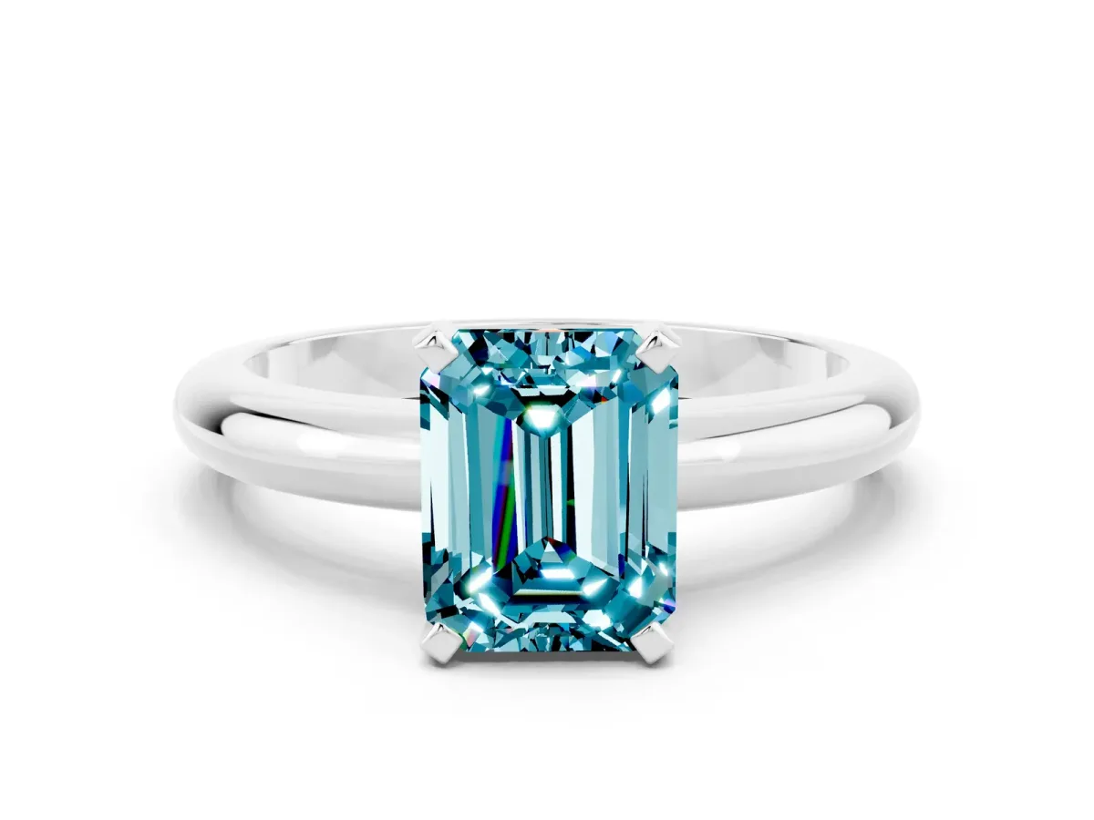 Emerald Cut Blue Topaz Solitaire Engagement Ring with Round Band and Four-Prong Setting Silver
