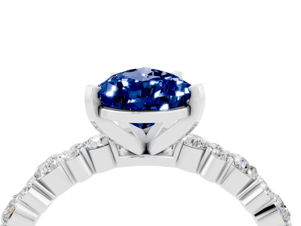 Pear Cut Blue Sapphire Side Stone Solitaire Ring with Round and Four-Prong Setting White gold