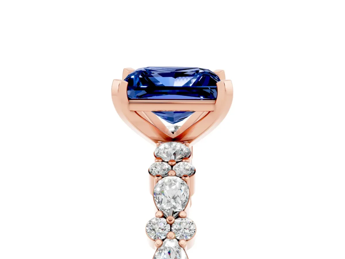 Princess Cut Blue Sapphire Side Stone Solitaire Ring with Round and Four-Prong Setting Rose gold