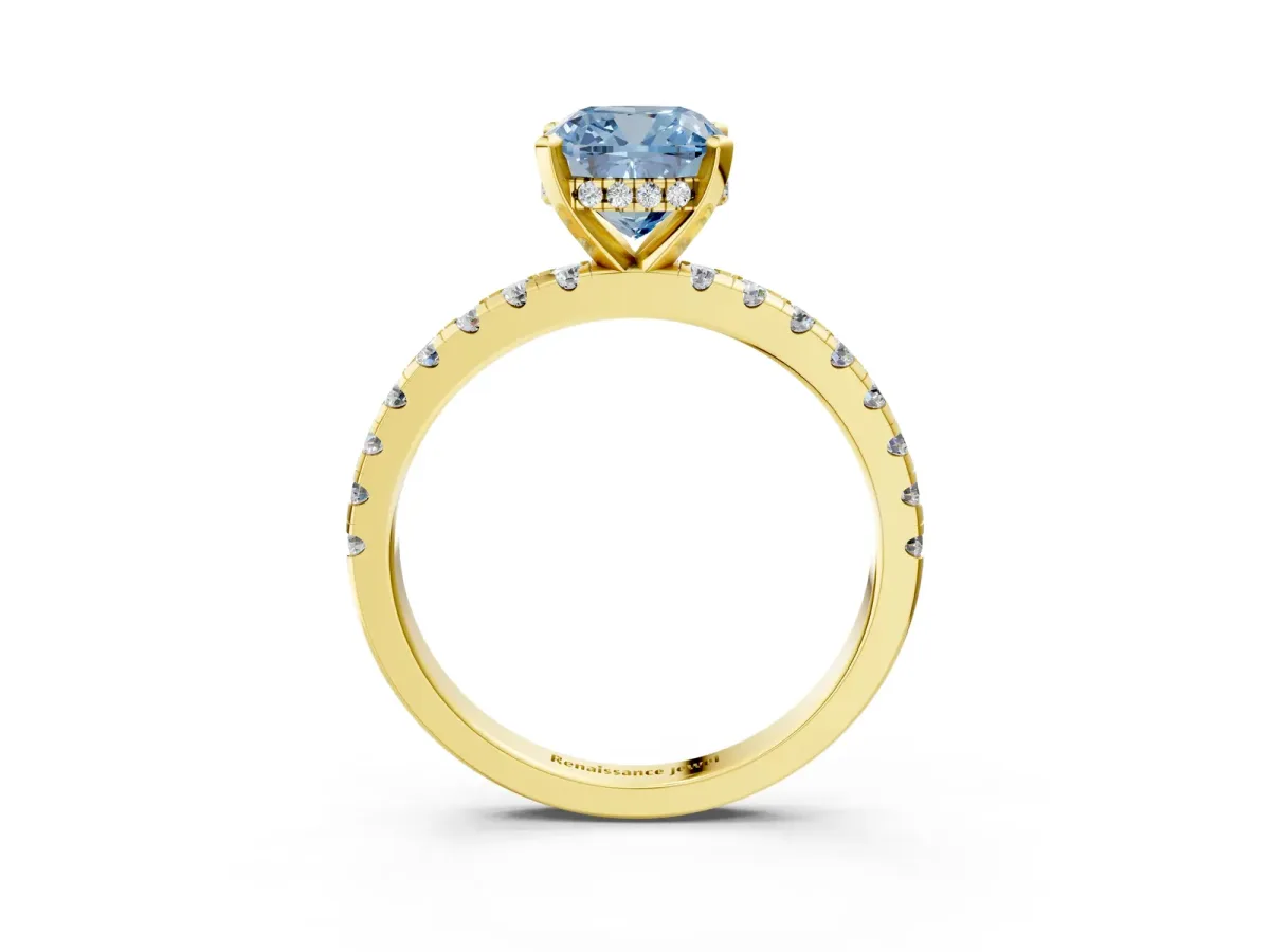 Fancy Blue Cushion Cut Diamond Solitaire Ring with Round Pavé Band and Four-Prong Setting Yellow gold