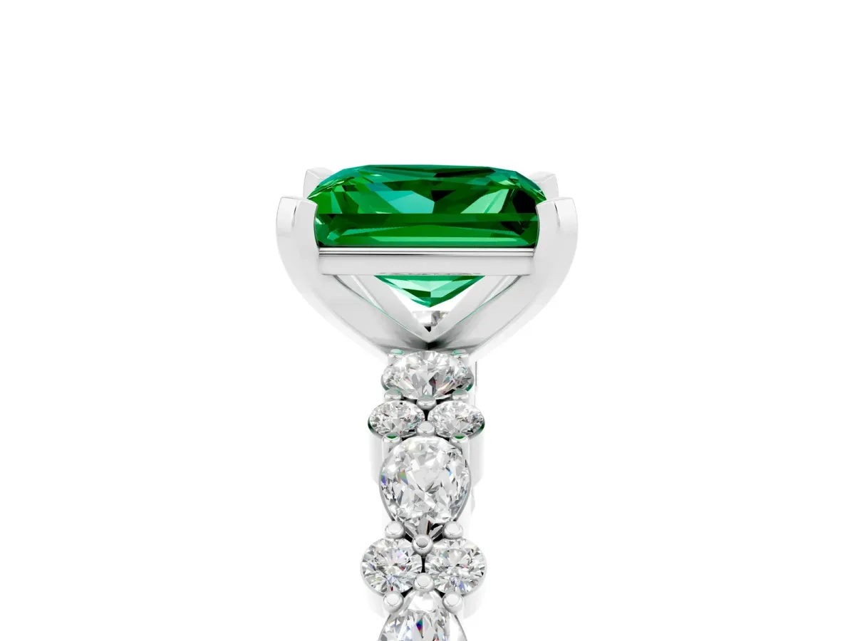 Princess Cut Emerald Side Stone Solitaire Ring with Round and Four-Prong Setting Silver