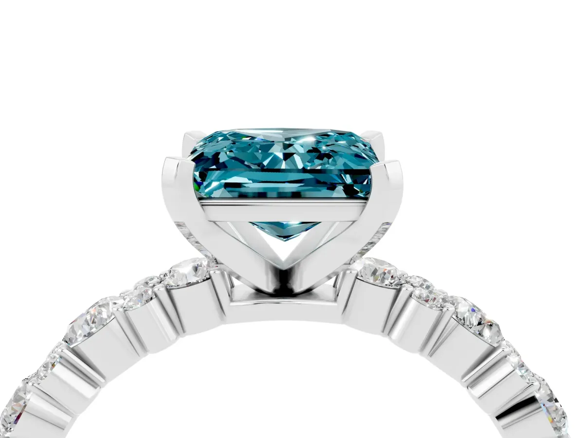 Princess Cut Blue Topaz Side Stone Solitaire Ring with Round and Four-Prong Setting Silver