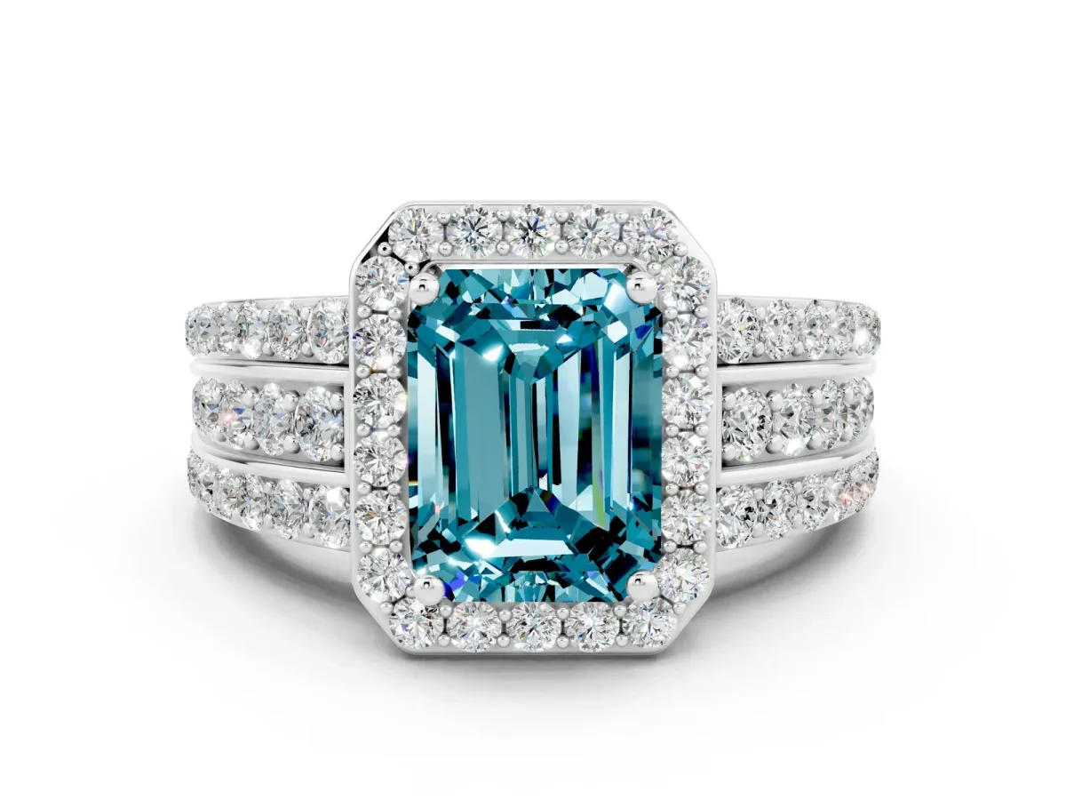 Emerald Cut Halo Blue Topaz Ring with Round Split Shank and Prong Setting White gold