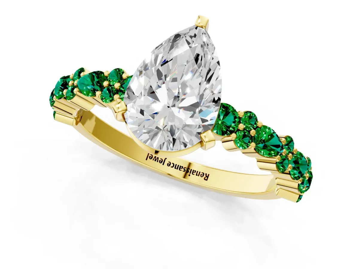 Pear Cut Diamond Side Stone Solitaire Ring with Round Emerald and Four-Prong Setting Yellow gold