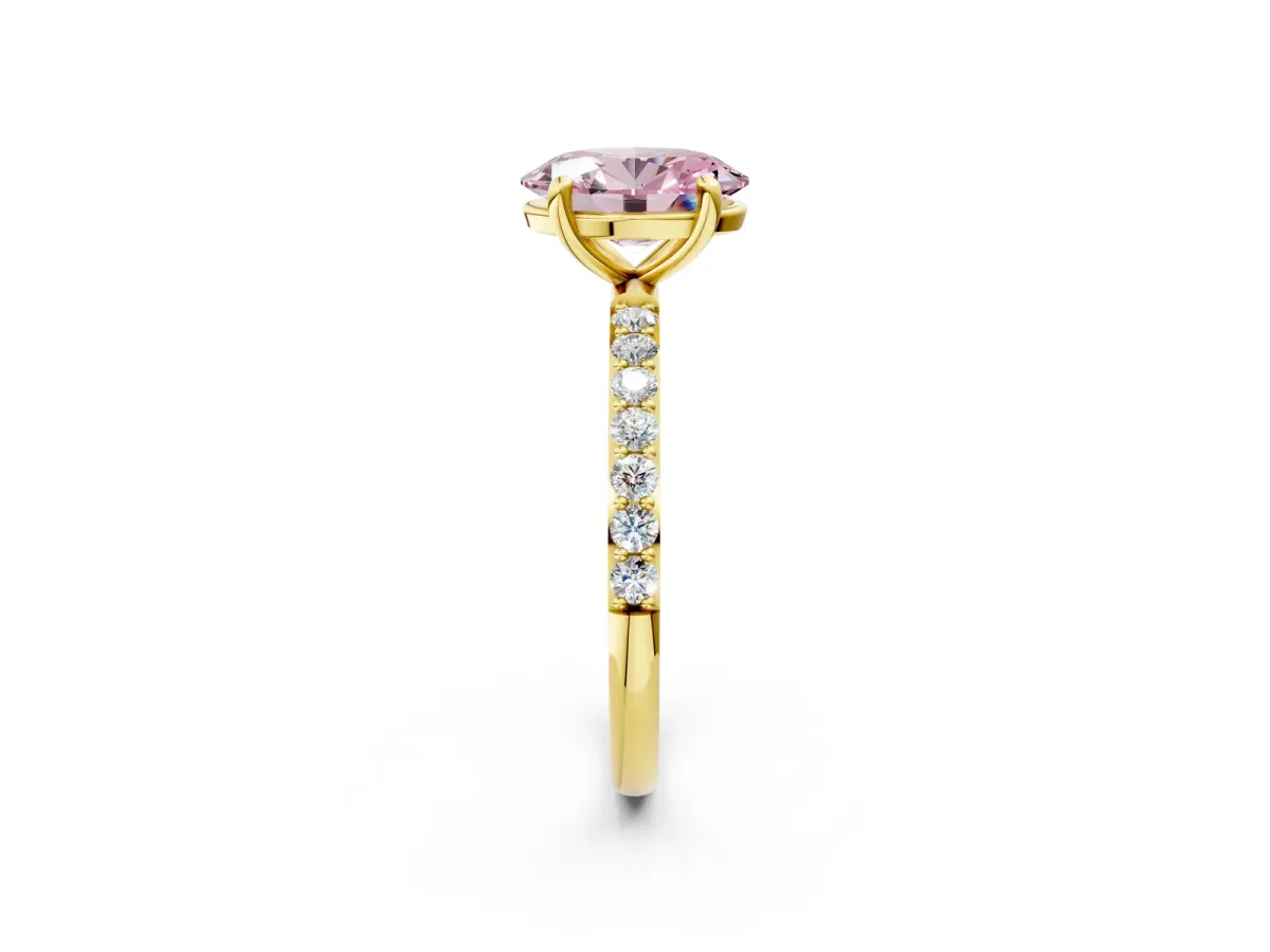 Fancy Pink Oval Cut Diamond Solitaire Ring with Round Pavé Band and Prong Setting Yellow gold