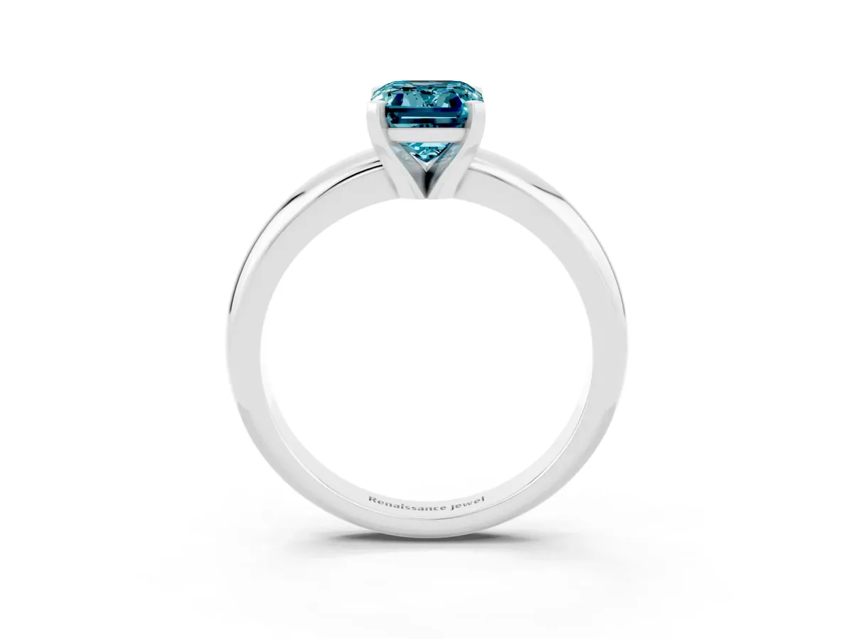 Emerald Cut Blue Topaz Solitaire Engagement Ring with Round Band and Four-Prong Setting Silver