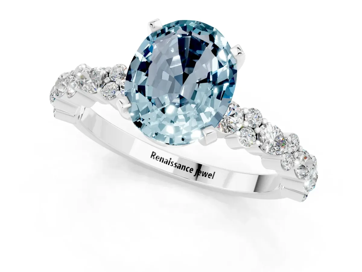 Oval Cut Aquamarine Side Stone Solitaire Ring with Round and Four-Prong Setting White gold