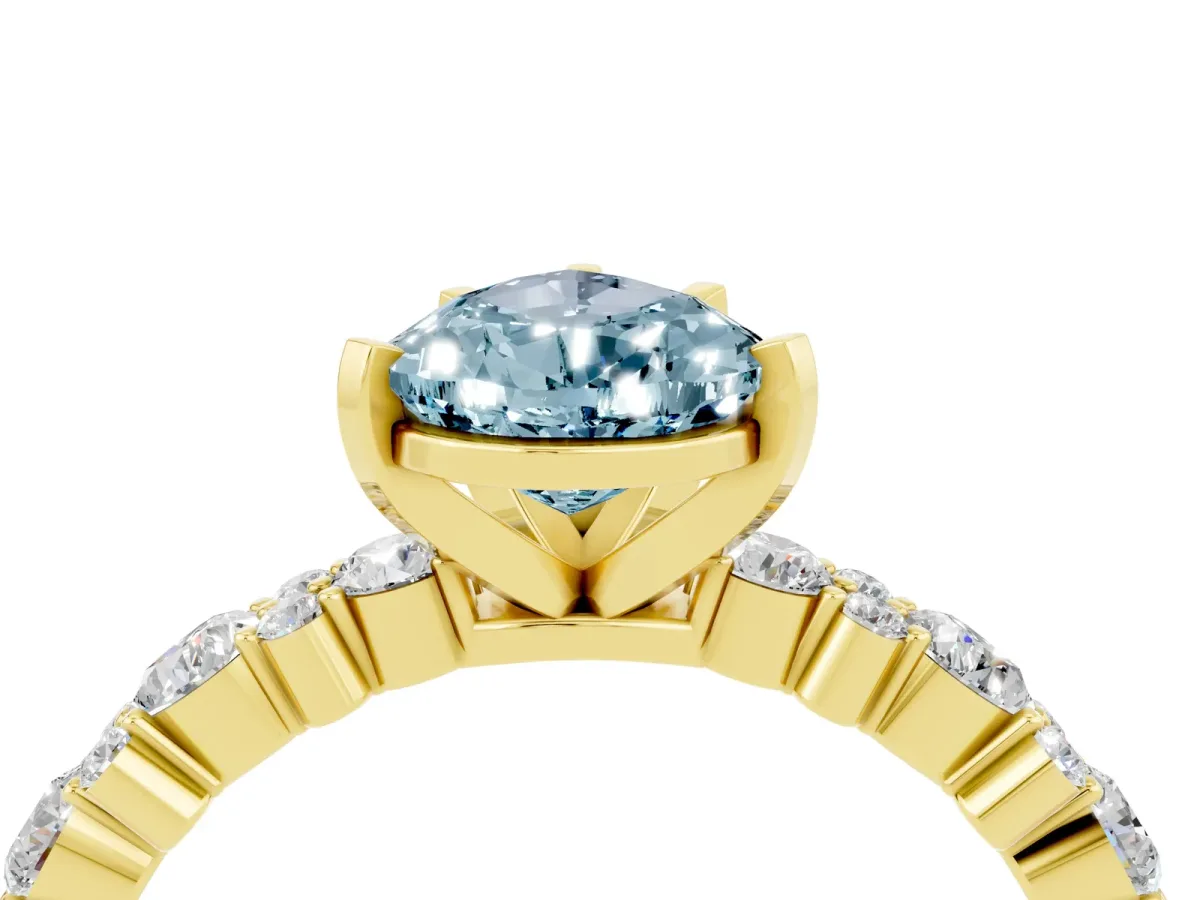 Pear Cut Aquamarine Side Stone Solitaire Ring with Round and Four-Prong Setting Yellow gold