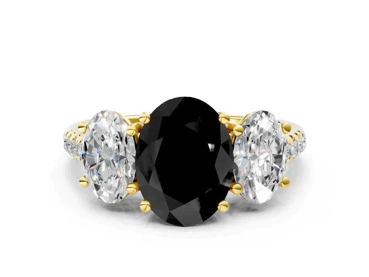 Fancy Black Three-Stone Oval Cut Diamond Ring with Round Pavé Band and Prong Setting Yellow gold