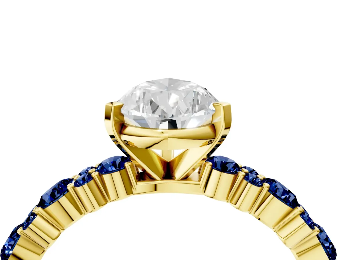 Pear Cut Diamond Side Stone Solitaire Ring with Round Blue Sapphire and Four-Prong Setting Yellow gold