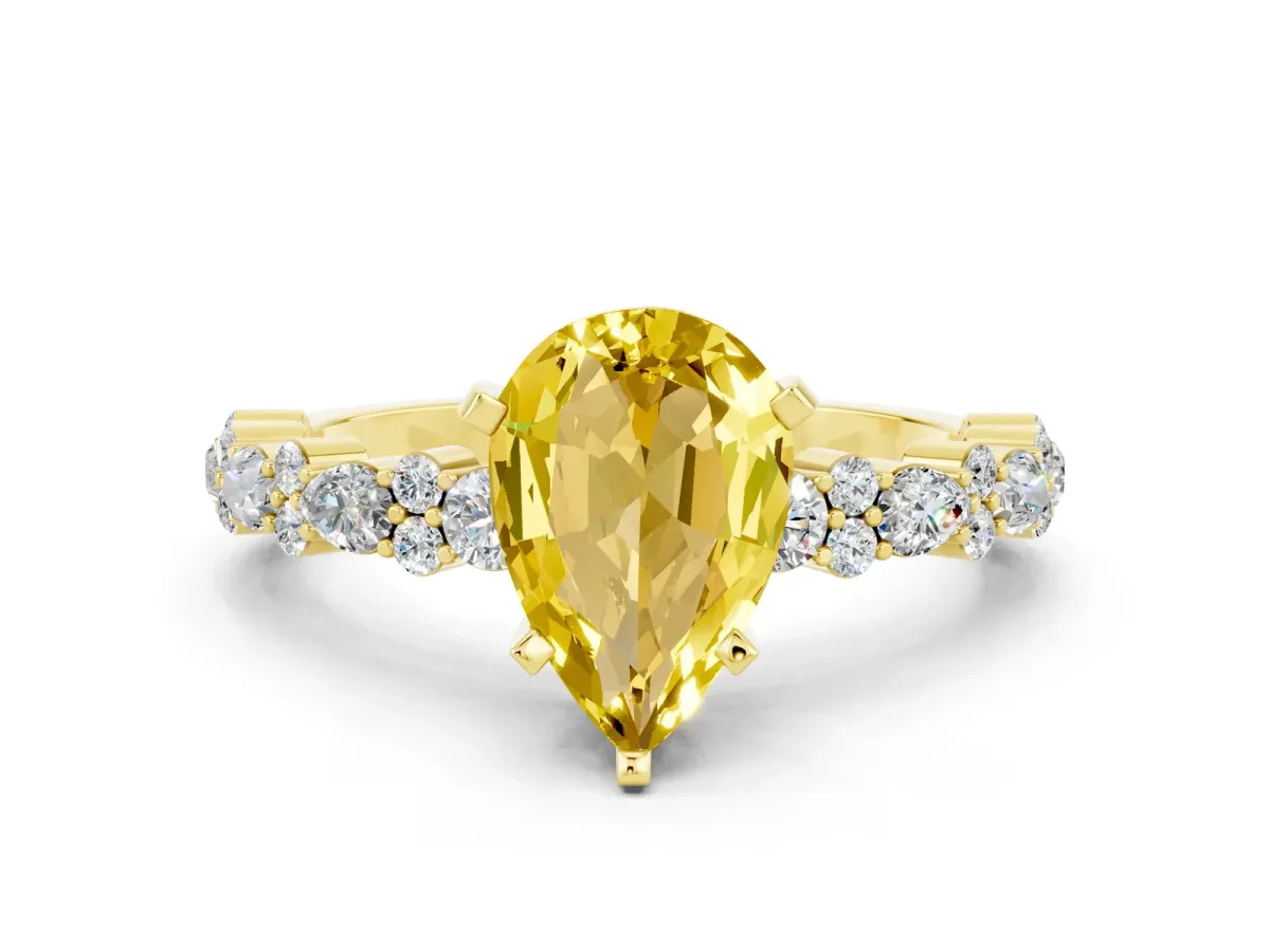 Pear Cut Yellow Sapphire Side Stone Solitaire Ring with Round and Four-Prong Setting Yellow gold