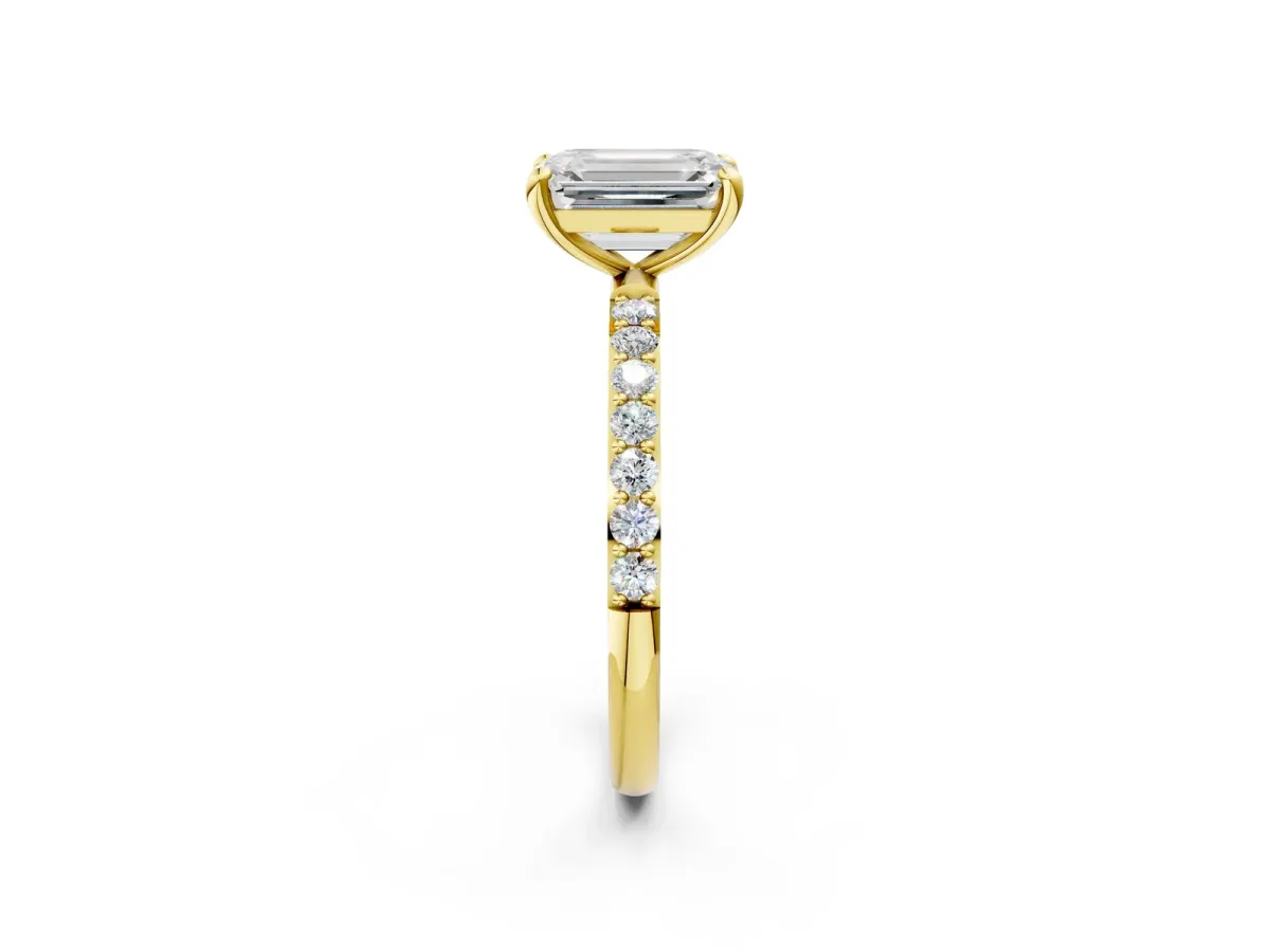 Emerald Cut Diamond Solitaire Ring with Round Moissanite Pavé Band and Prong Setting Yellow gold