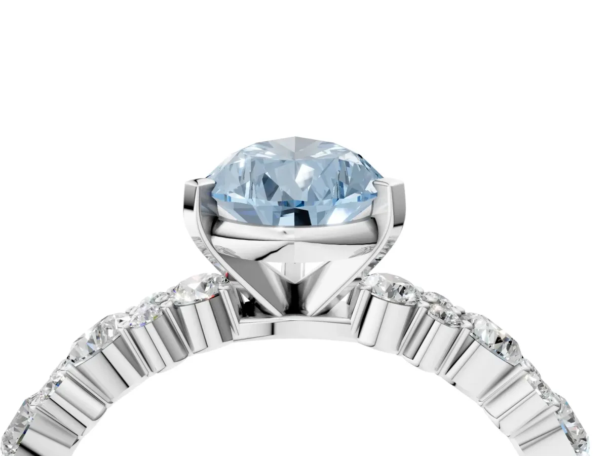Fancy Blue Pear Cut Diamond Side Stone Solitaire Ring with Round and Four-Prong Setting Platinum
