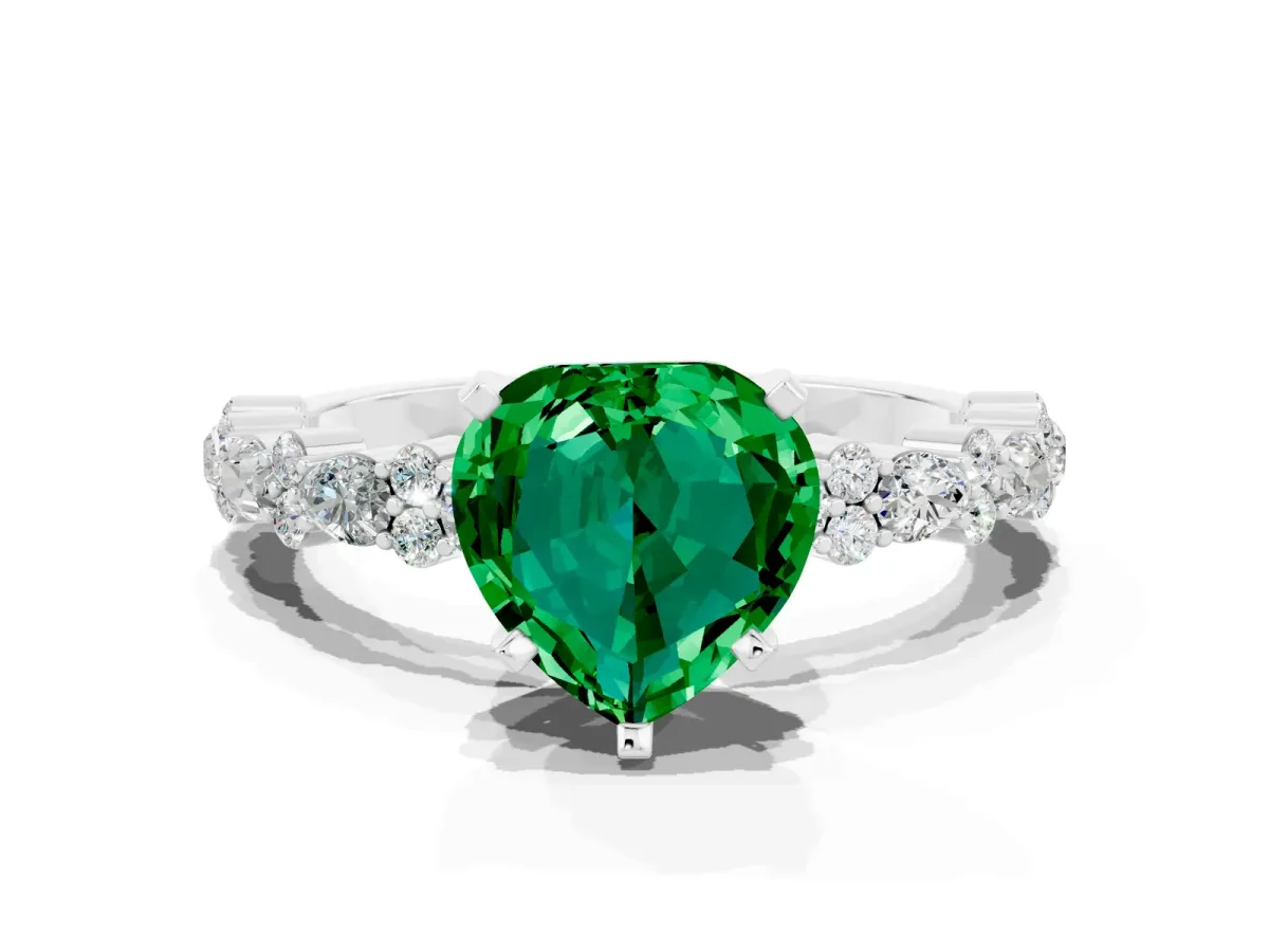 Heart Cut Emerald Side Stone Solitaire Ring with Round and Four-Prong Setting Silver