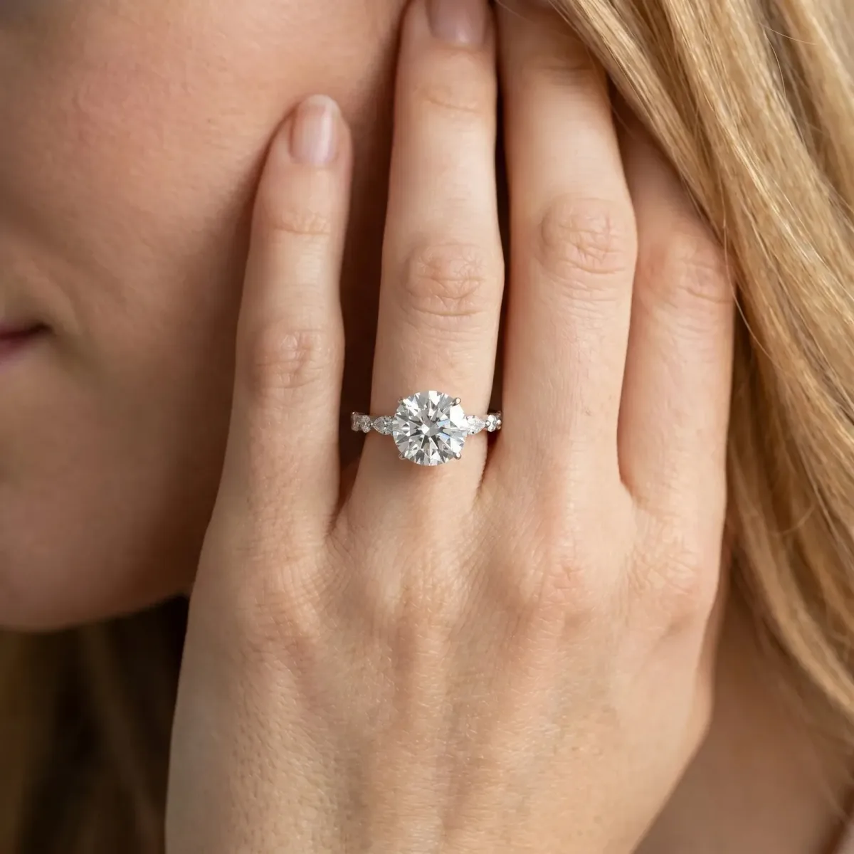 Round Cut Diamond Ring with Marquise and Round Side Stones and Four-Prong Setting White gold