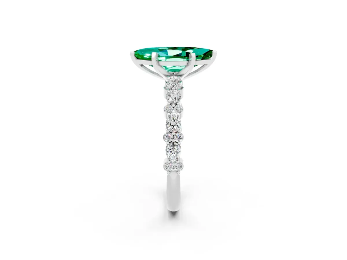 Marquise Cut Emerald Side Stone Solitaire Ring with Round and Four-Prong Setting White gold