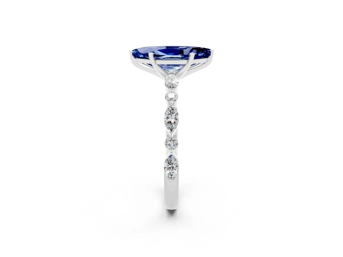 Marquise Cut Blue Sapphire Ring with Marquise and Round Side Stones and Four-Prong Setting Silver