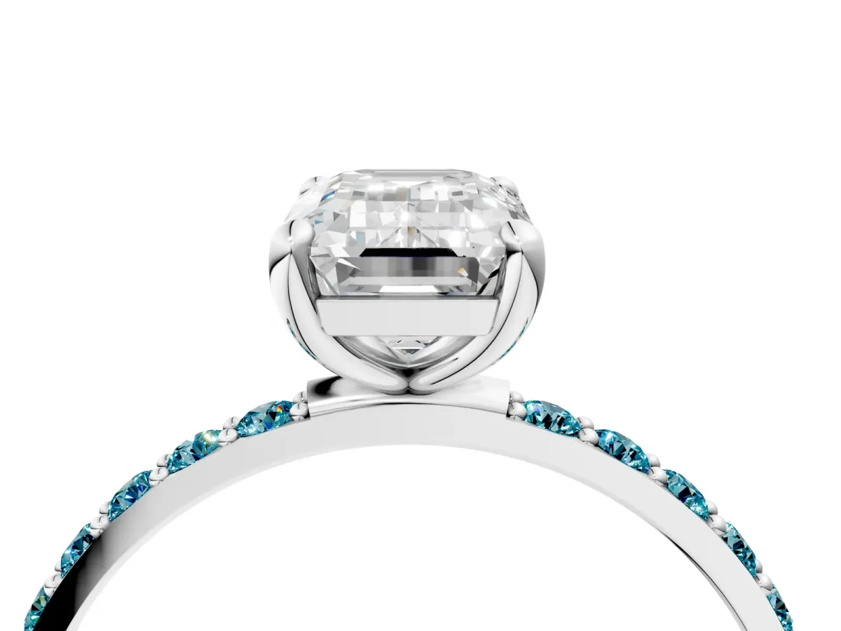 Emerald Cut Diamond Solitaire Ring with Round Blue Topaz Pavé Band and Prong Setting Silver
