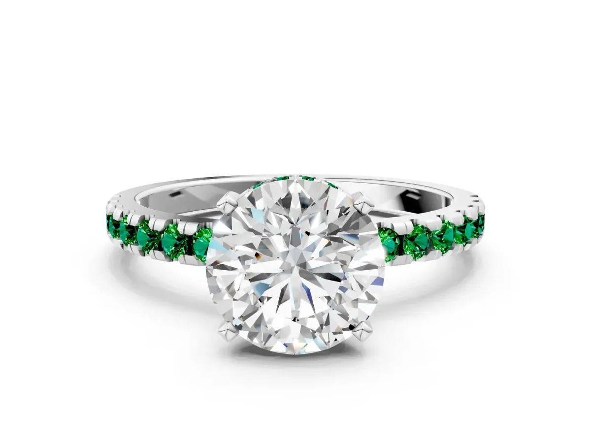 Round Cut Diamond Solitaire Ring with Round Emerald Pavé Band and Four-Prong Setting White gold