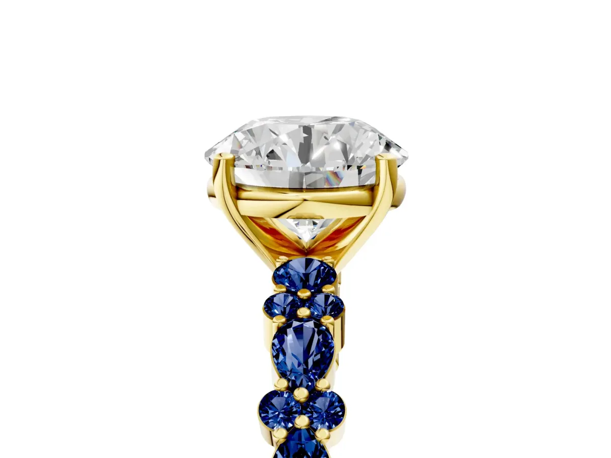 Round Cut Diamond Side Stone Solitaire Ring with Round Blue Sapphire and Four-Prong Setting Yellow gold