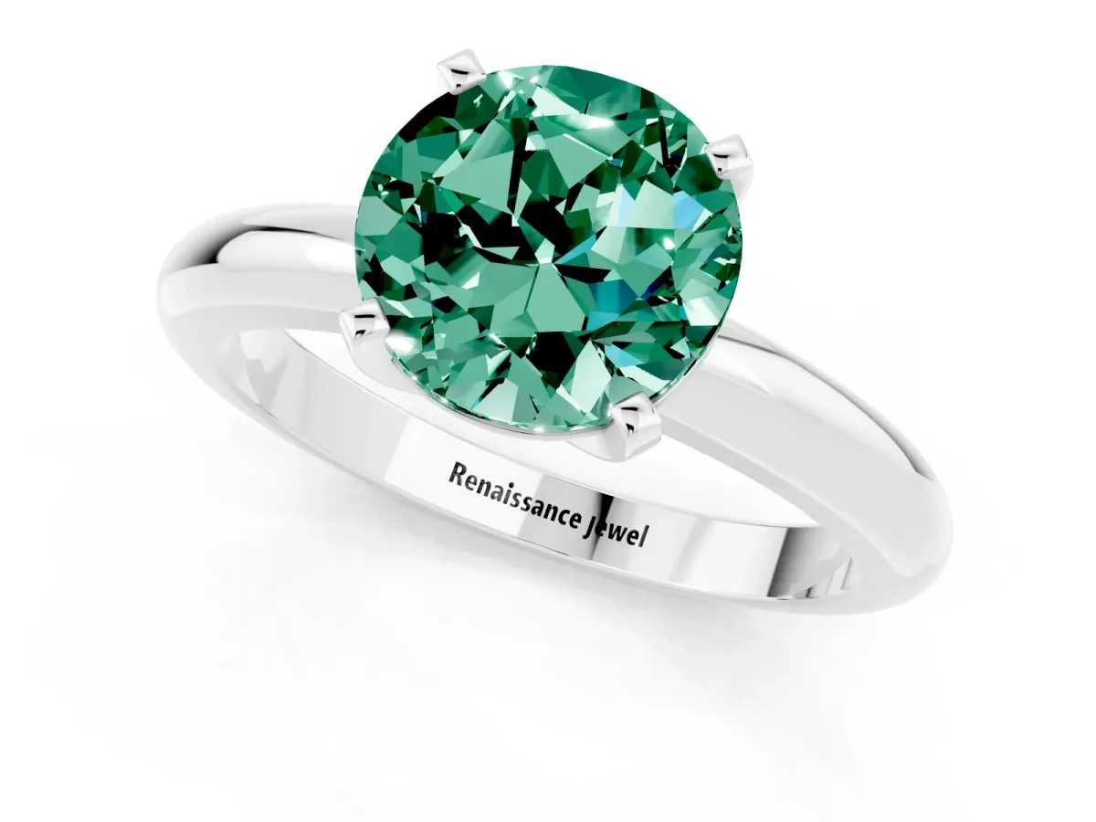 Round Cut Green Sapphire Solitaire Engagement Ring with Round Band and Four-Prong Setting Silver