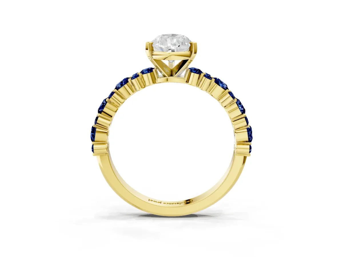 Pear Cut Diamond Side Stone Solitaire Ring with Round Blue Sapphire and Four-Prong Setting Yellow gold